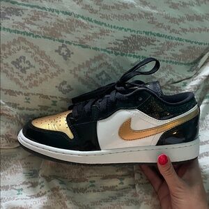 Air Jordan 1 Low Black, White, and Gold Sneakers